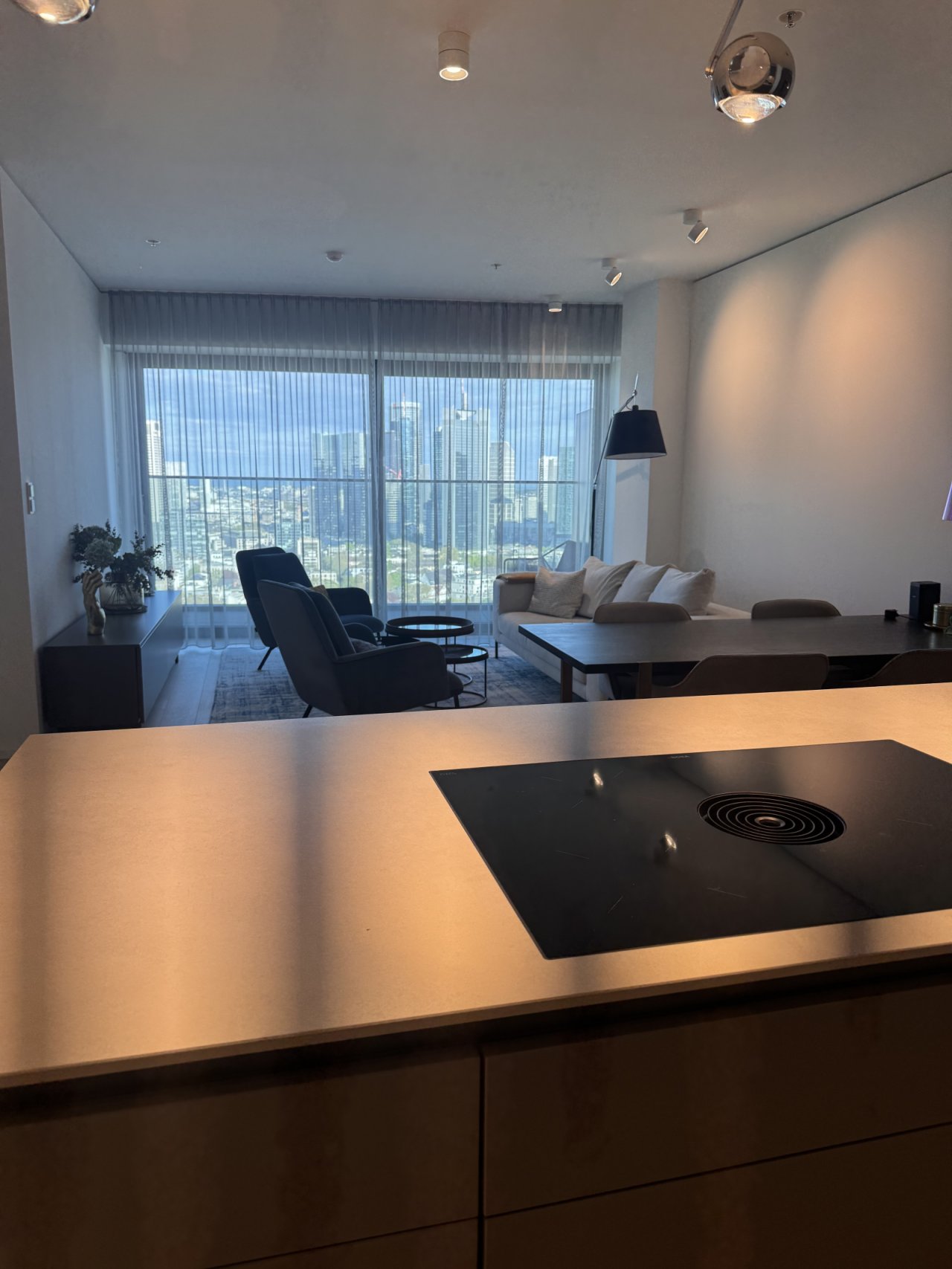 Modern kitchen-living area with high-quality furnishings and open layout