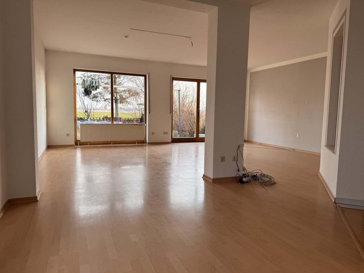 Bright living area with floor-to-ceiling windows and open floor plan